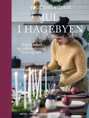 Omslag: "Jul i hagebyen : adventskos og julestemning inne og ute : ideer - inspirasjon - oppskrifter" av Victoria Dam
